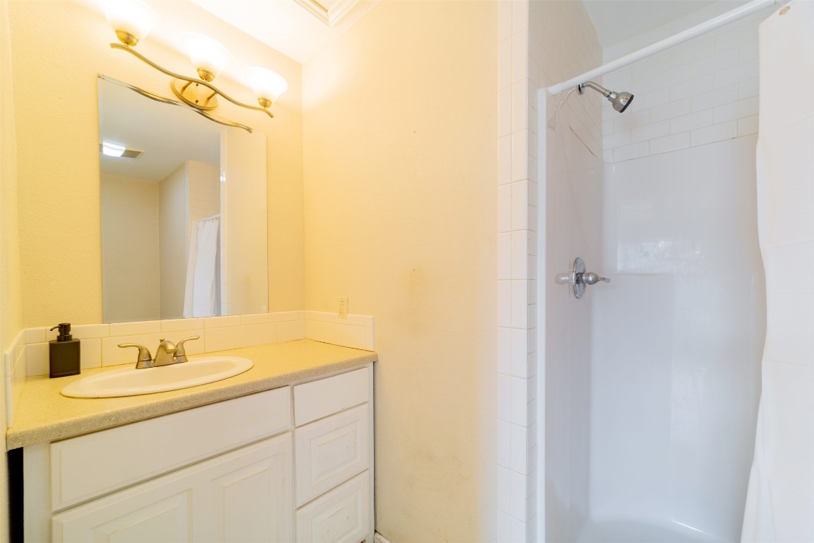 1738 Rutland Drive, Unit A Austin, TX 78758 - Photo 29 of 30 a bathroom with a sink and mirror