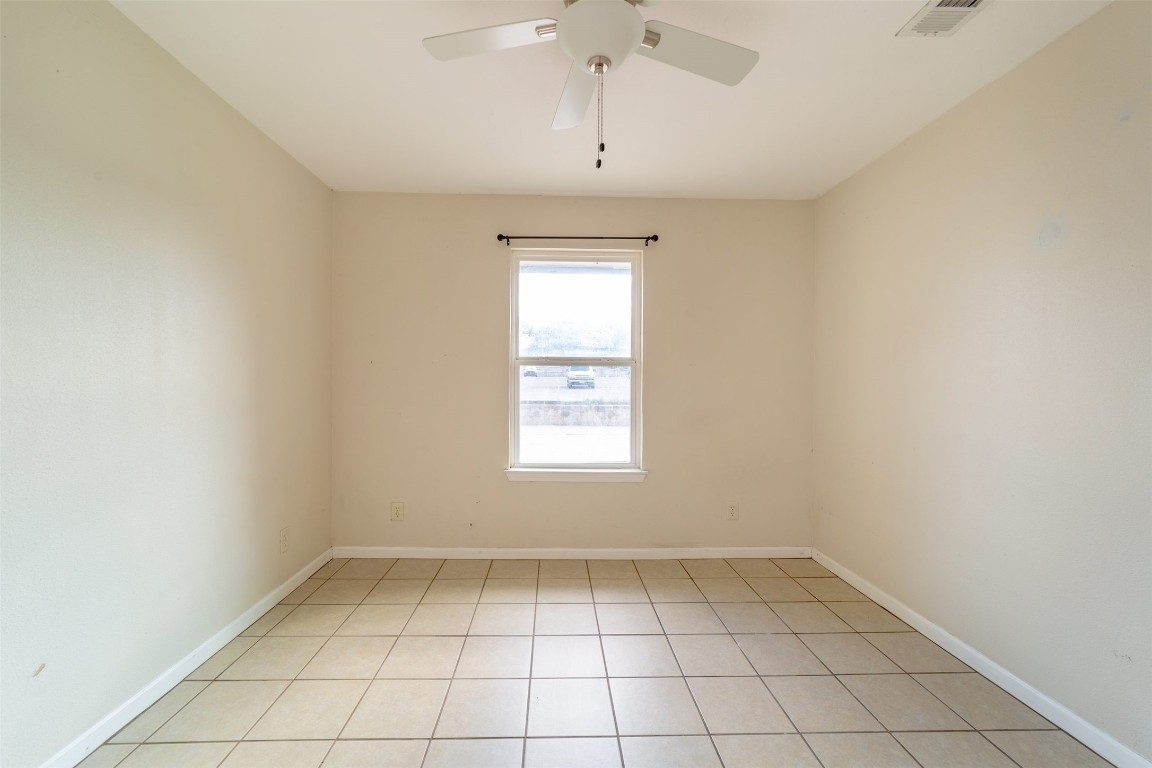 1738 Rutland Drive, Unit A Austin, TX 78758 - Photo 4 of 30 an empty room with a window