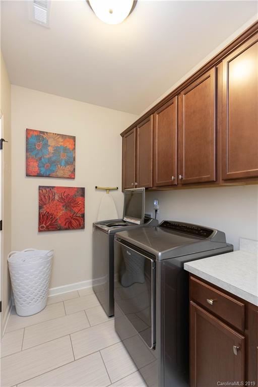 1612 Basil Court Tega Cay, SC 29708 - Photo 22 of 45 a kitchen with a cabinets and window