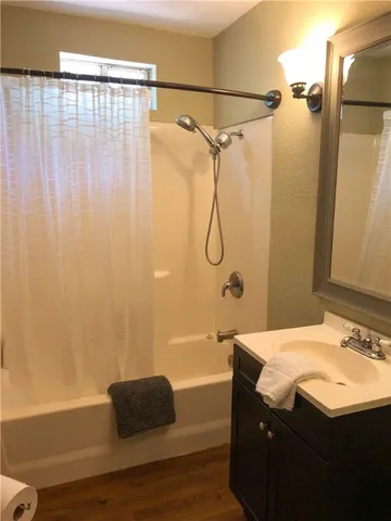 a bathroom with a sink and a shower