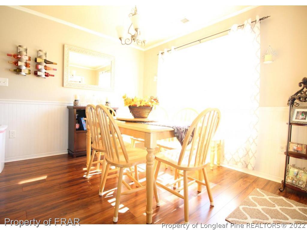 698 Cape Fear Road Raeford, NC 28376 - Photo 5 of 24 a view of a room with furniture and wooden floor