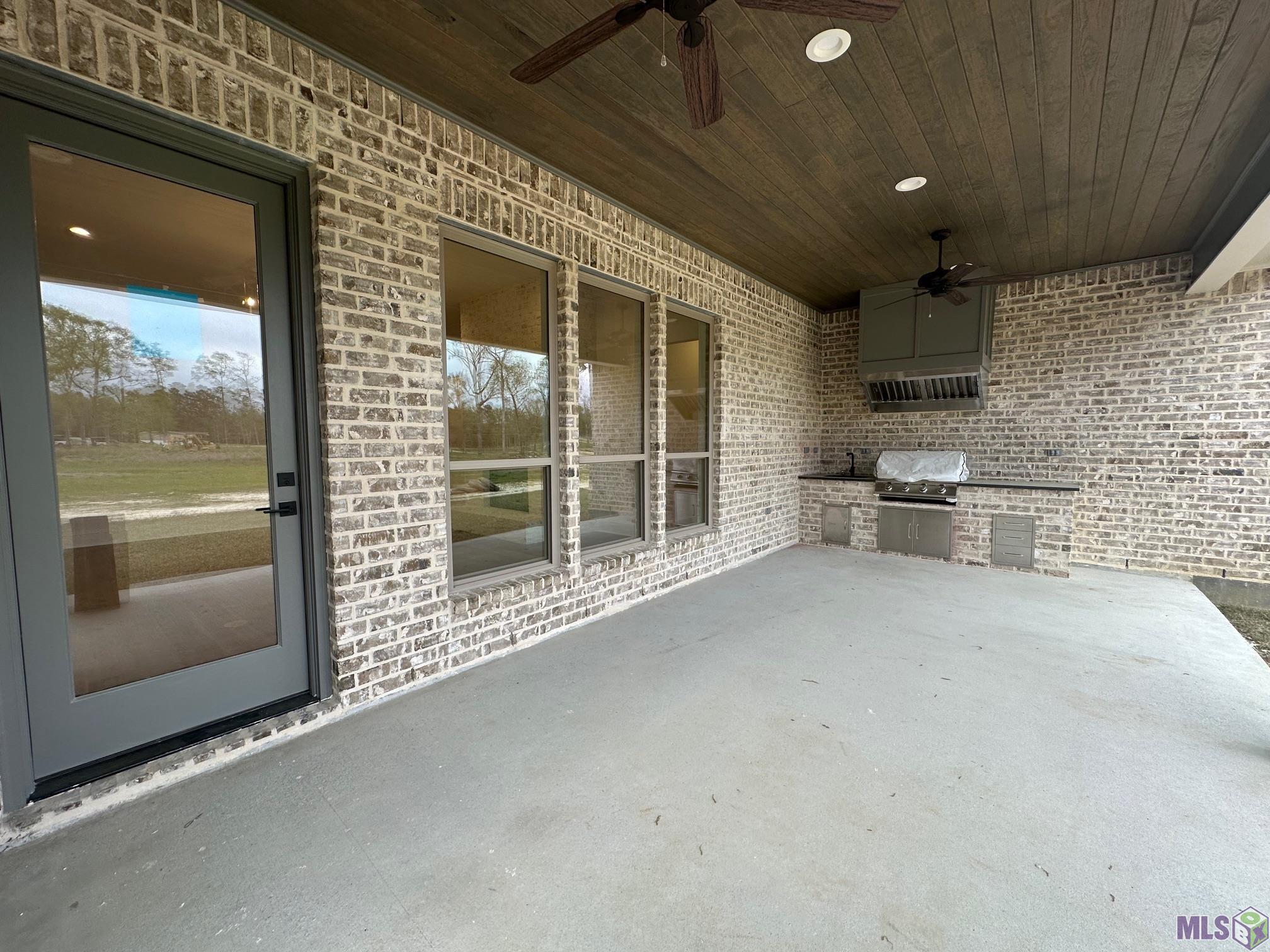 9085 Hillon Hood Road Denham Springs, LA 70726 - Photo 34 of 36 Large OUTDOOR LIVING AREA with OUTDOOR KITCHEN