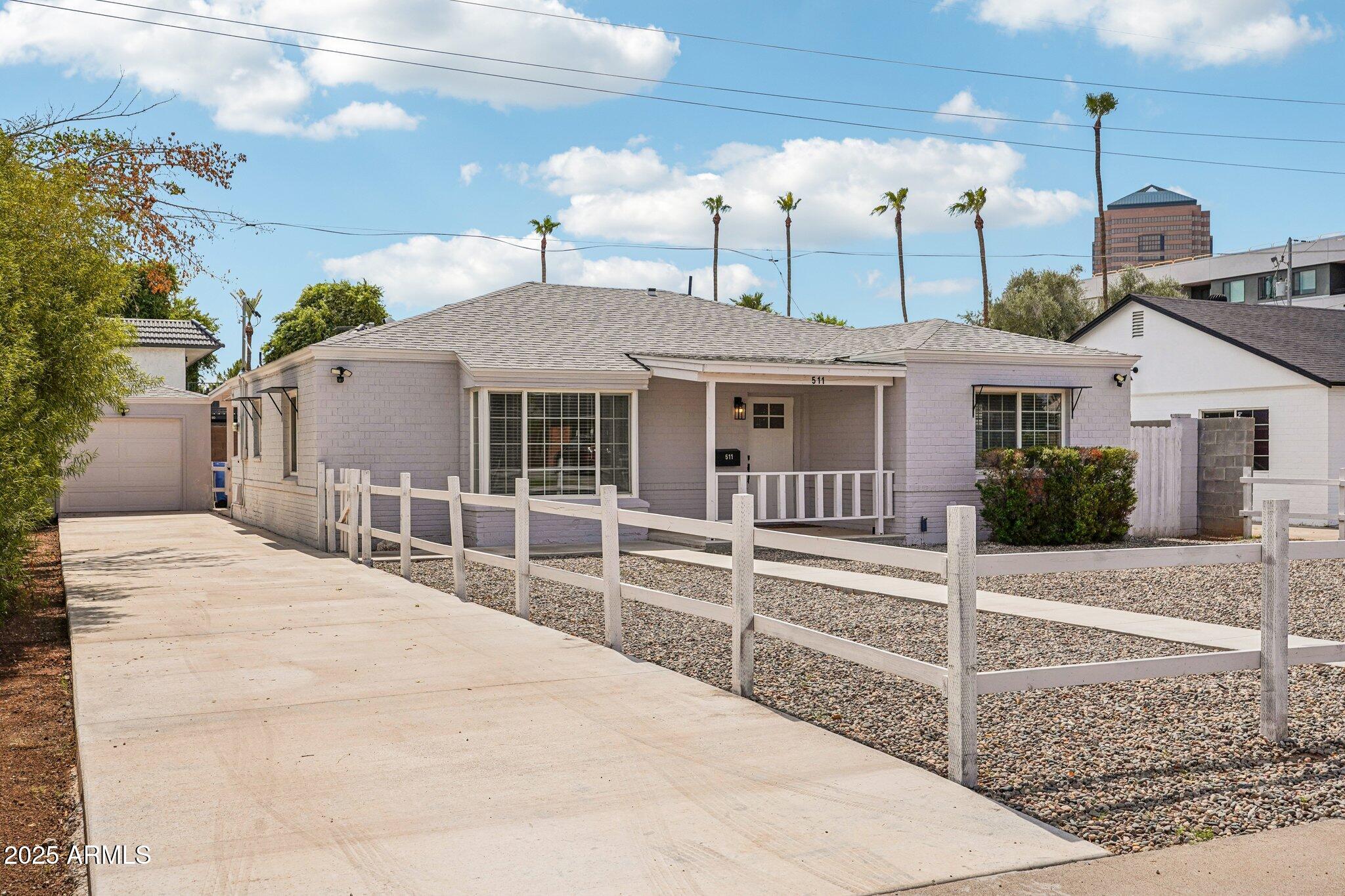 511 East Cheery Lynn Road Phoenix, AZ 85012 - Photo 1 of 33 a front view of a house with a porch
