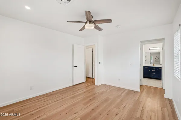 a view of an empty room and a window