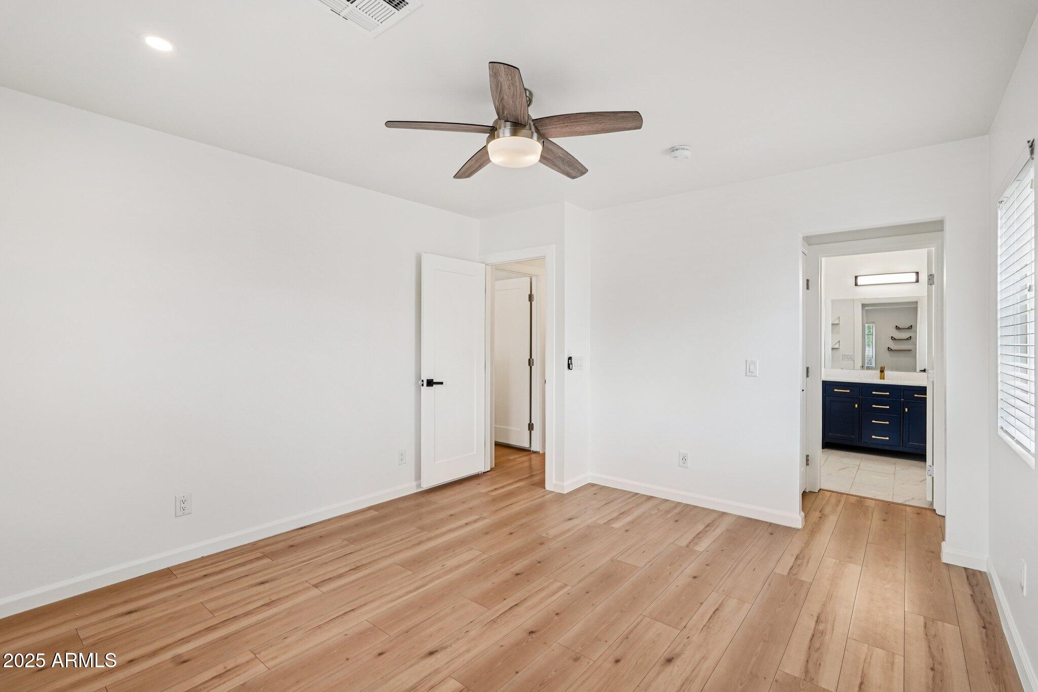 511 East Cheery Lynn Road Phoenix, AZ 85012 - Photo 13 of 33 a view of empty room with wooden floor