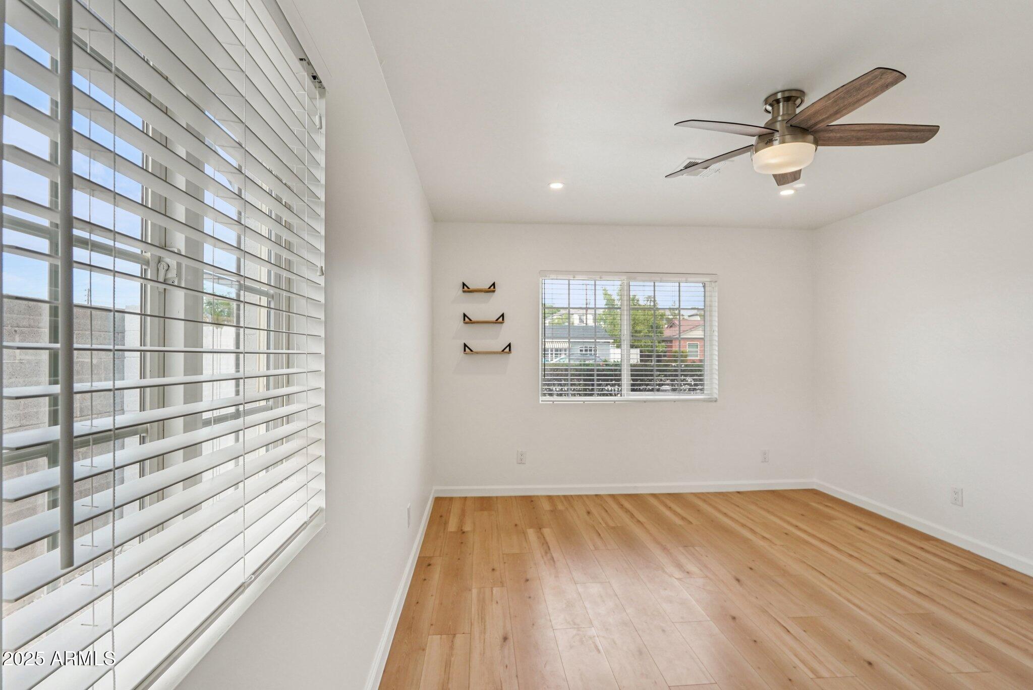 511 East Cheery Lynn Road Phoenix, AZ 85012 - Photo 14 of 33 a view of an empty room and a window