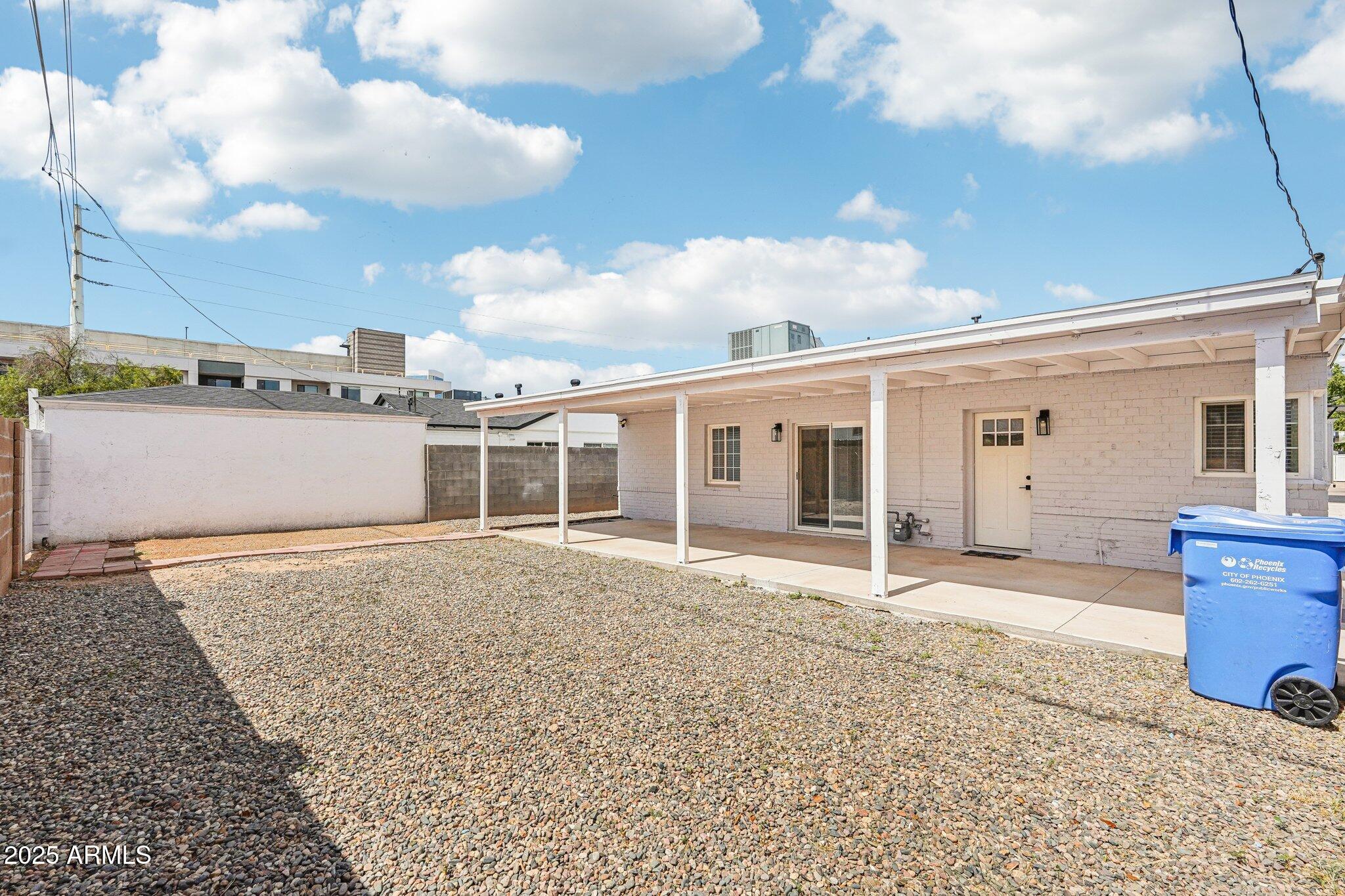 511 East Cheery Lynn Road Phoenix, AZ 85012 - Photo 25 of 33 a view of a house with a patio