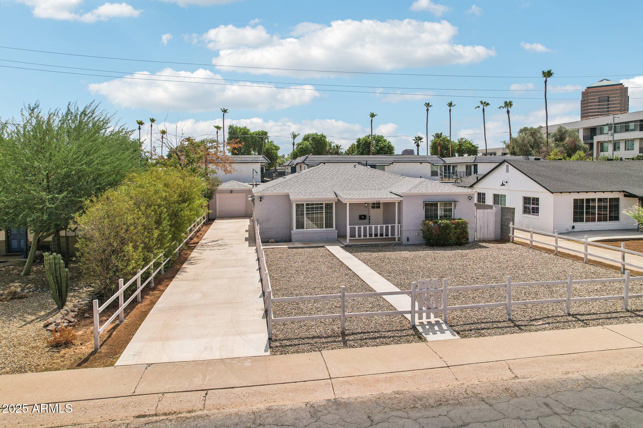 511 East Cheery Lynn Road Phoenix, AZ 85012 - Photo 4 of 33 a aerial view of a house with a garden and pathway