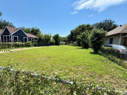 a front view of a house with yard and green space