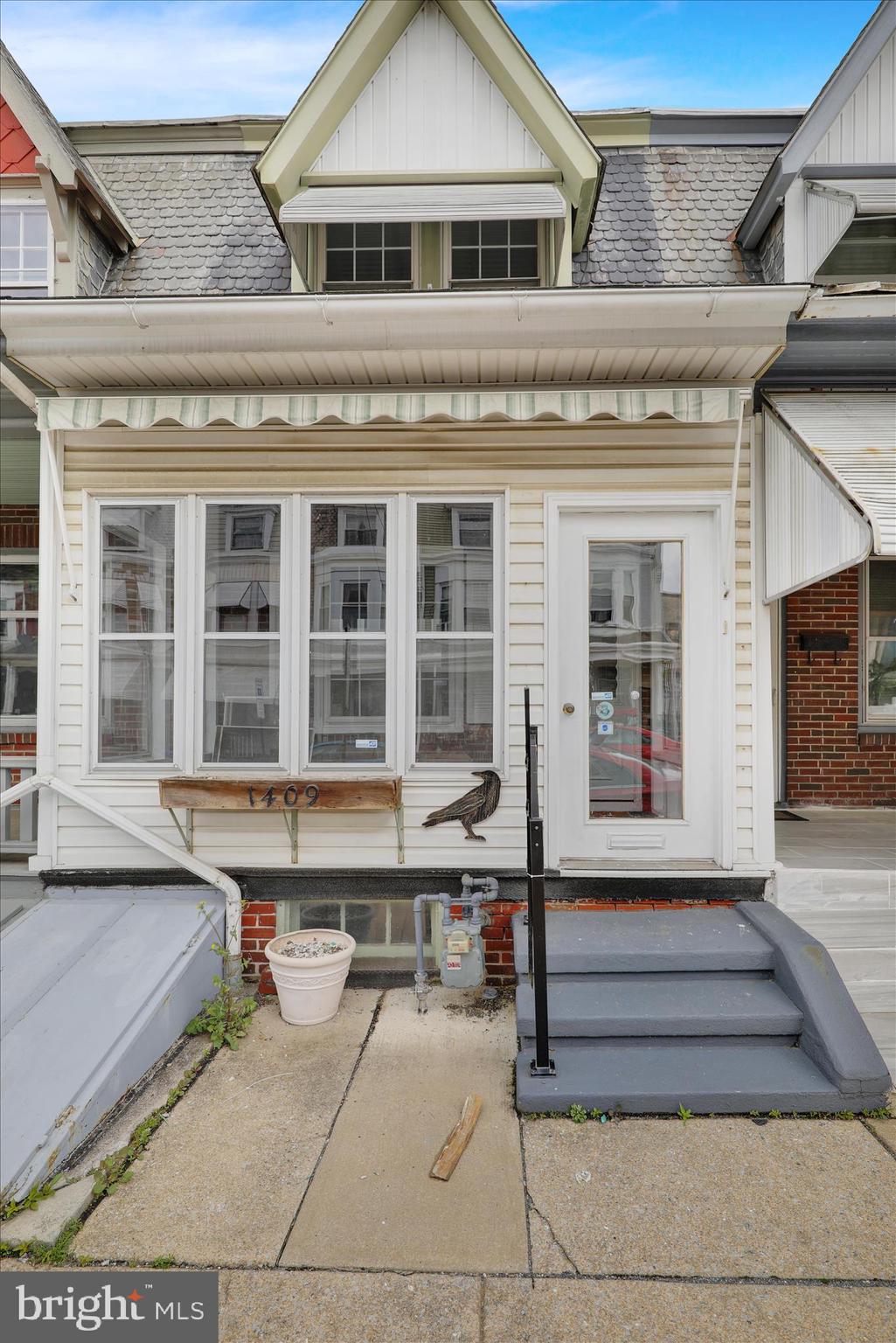 1409 Church Street Reading, PA 19601 - Photo 3 of 23 a front view of a house with a sitting area