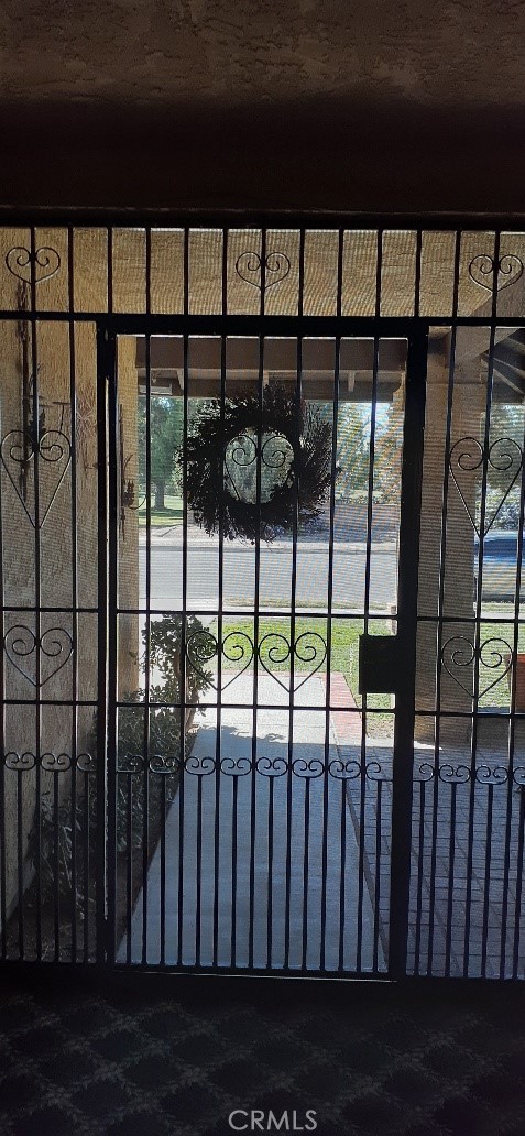 1484 Pepper Tree Drive Hemet, CA 92545 - Photo 5 of 24 Security court gate Entrance