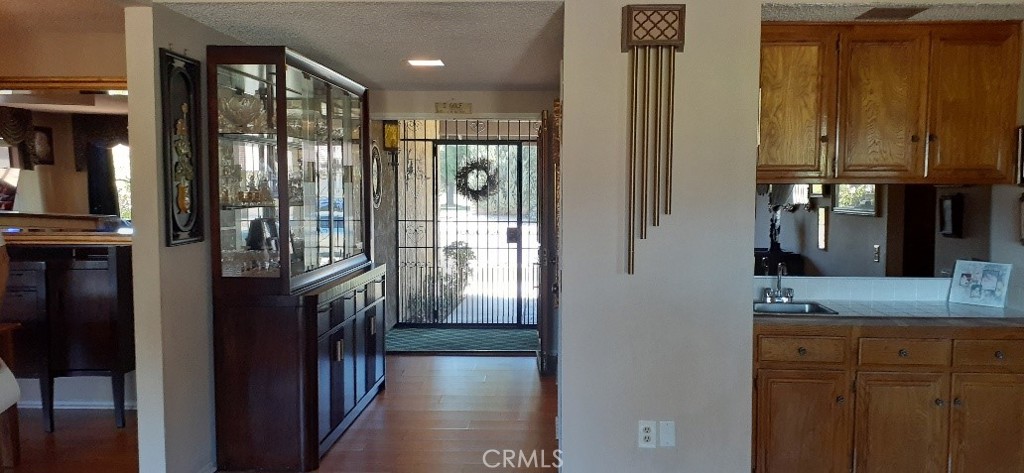 1484 Pepper Tree Drive Hemet, CA 92545 - Photo 6 of 24 Entrance from front door interior double secured can leave front doors open and still be safe with security porch. Wet Bar to the right