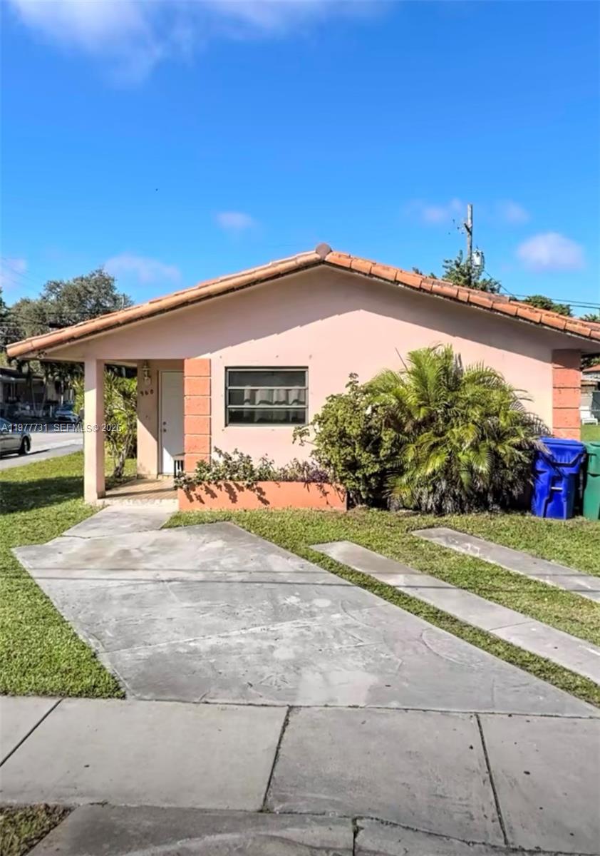 960 Southwest 13th Court Miami, FL 33135 - Photo 1 of 15 a view of a house with a yard