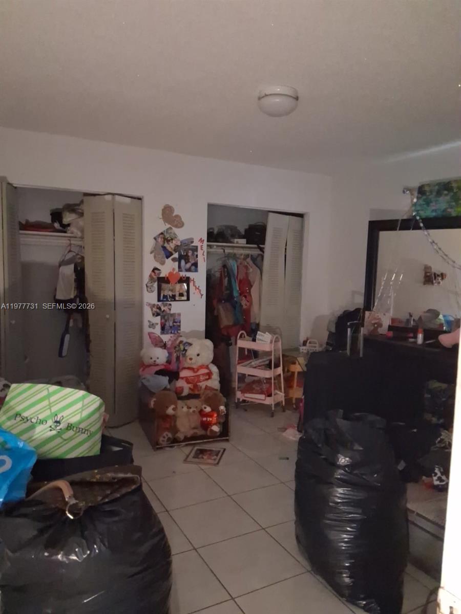 960 Southwest 13th Court Miami, FL 33135 - Photo 15 of 15 a room with furniture and a lamp