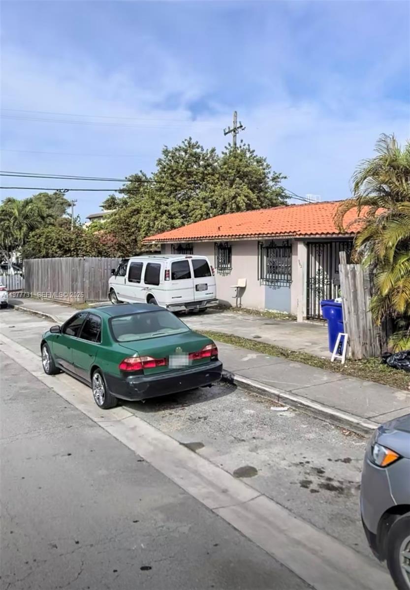 960 Southwest 13th Court Miami, FL 33135 - Photo 4 of 15 a car parked on the side of the road
