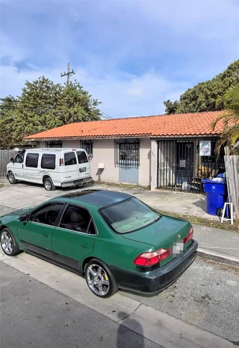 960 Southwest 13th Court Miami, FL 33135 - Photo 6 of 15 a front view of a house with garden