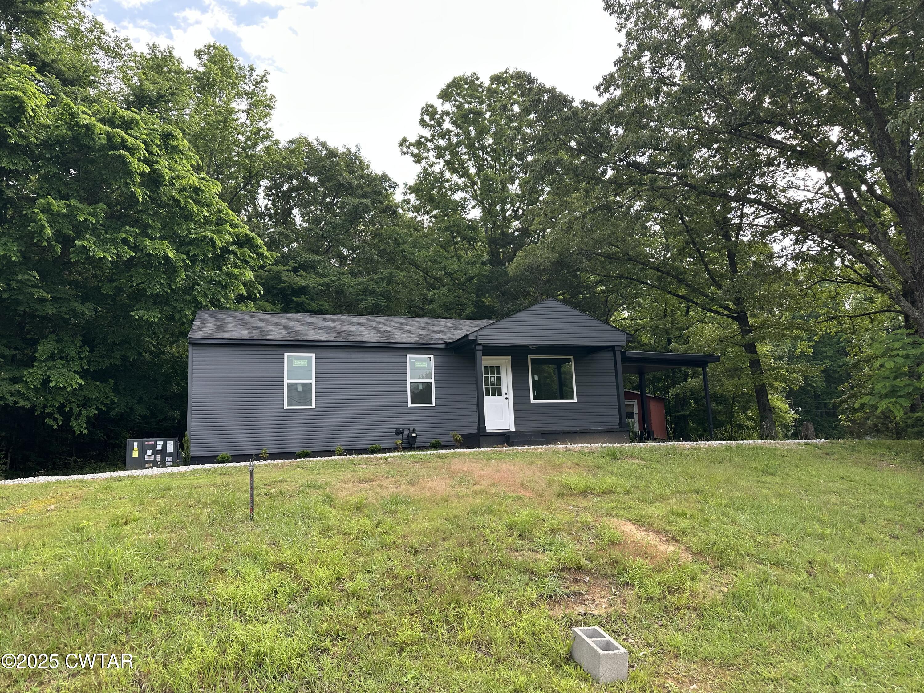 a brick house with a yard