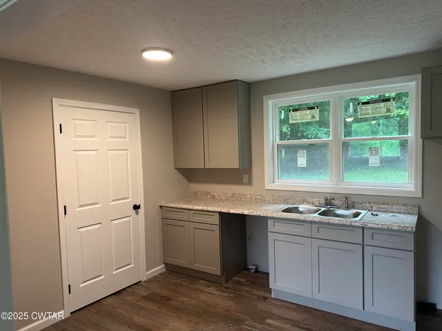 a kitchen with a sink and cabinets