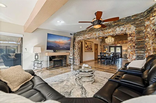 a bedroom with a large bed and a deck