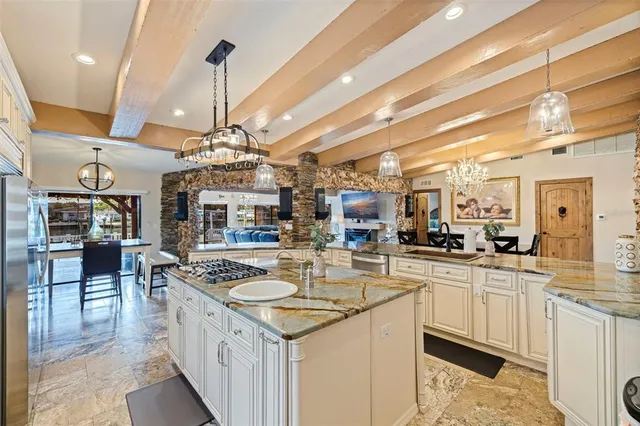 a kitchen with a sink stove and cabinets