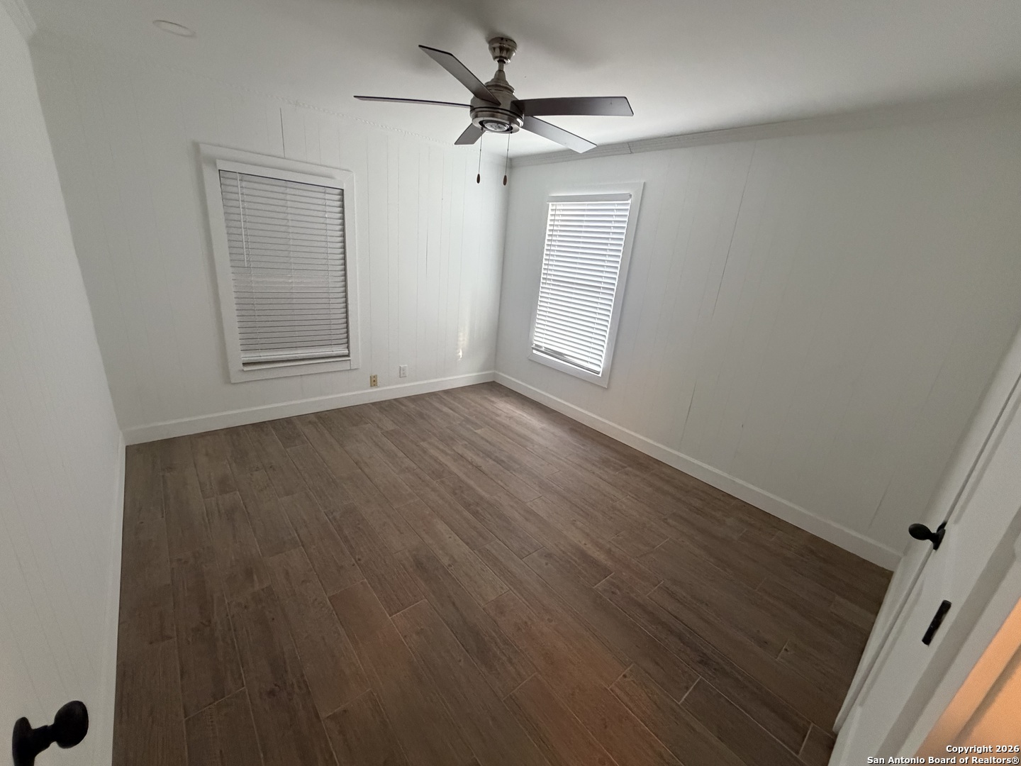 1635 Basse Road San Antonio, TX 78213 - Photo 11 of 17 wooden floor in an empty room with a window
