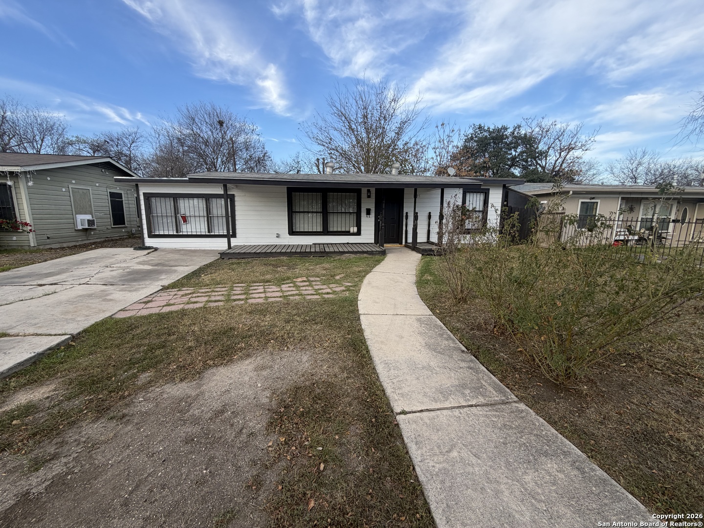 1635 Basse Road San Antonio, TX 78213 - Photo 2 of 17 a front view of a house with a yard and garage
