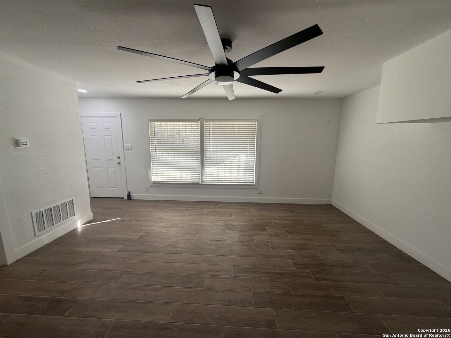 1635 Basse Road San Antonio, TX 78213 - Photo 3 of 17 an empty room with windows and fan