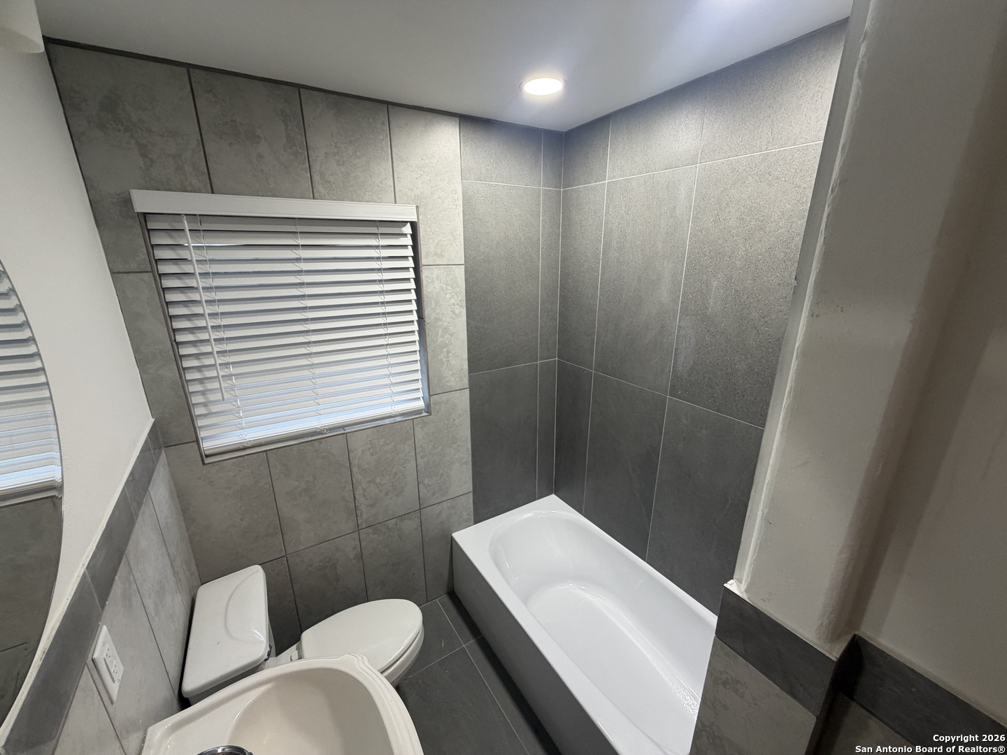 1635 Basse Road San Antonio, TX 78213 - Photo 8 of 17 a bathroom with a sink and toilet