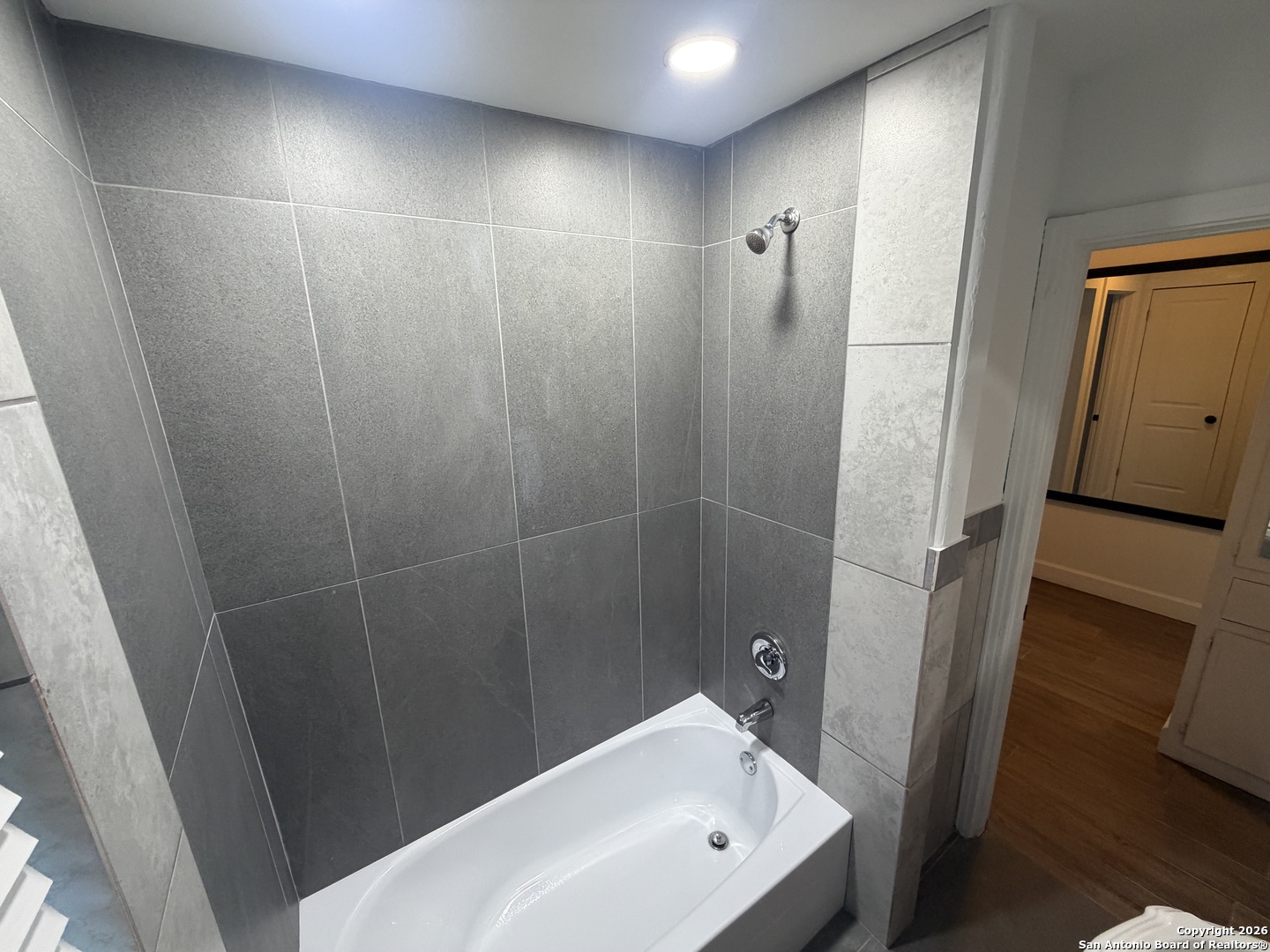 1635 Basse Road San Antonio, TX 78213 - Photo 9 of 17 a bathroom with a sink and shower