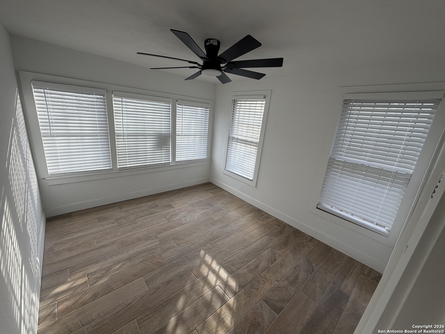 1635 Basse Road San Antonio, TX 78213 - Photo 10 of 17 a view of empty room with wooden floor and fan
