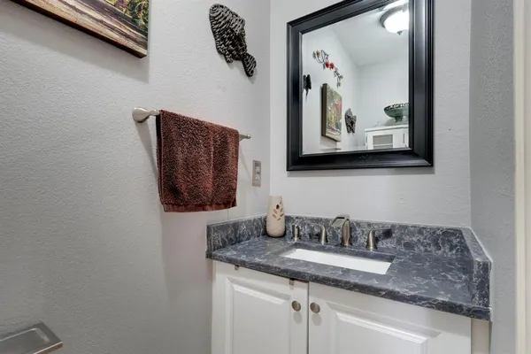 a bathroom with a sink and mirror