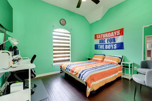 a bedroom with a bed and a table