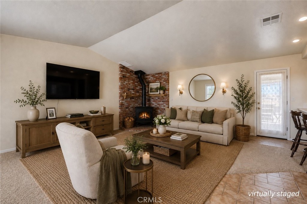 8650 Cowberry Road Phelan, CA 92371 - Photo 17 of 66 Welcome Home! Virtually Staged Living Room with Cozy Fireplace