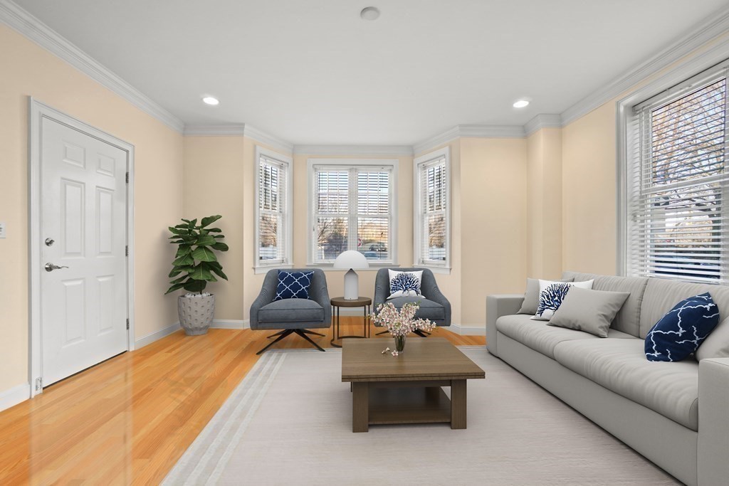 8 Howell Street, Unit 1 Boston, MA 02125 - Photo 5 of 14 a living room with furniture and a large window