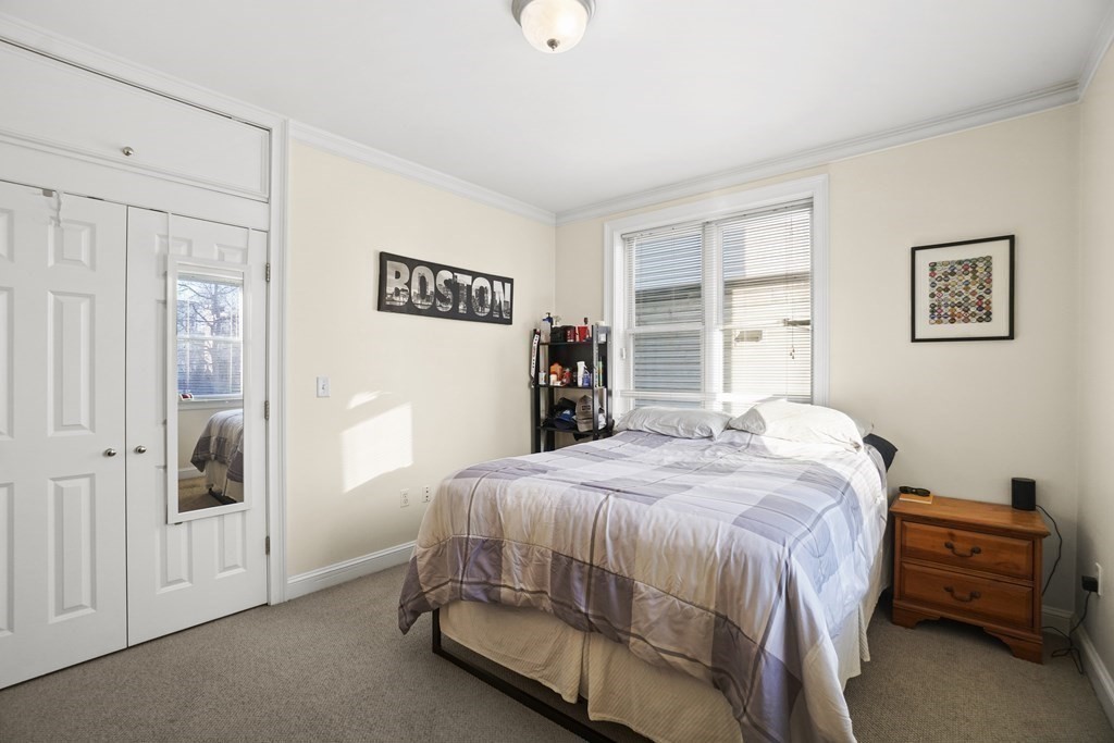 8 Howell Street, Unit 1 Boston, MA 02125 - Photo 7 of 14 a bedroom with a bed and a window