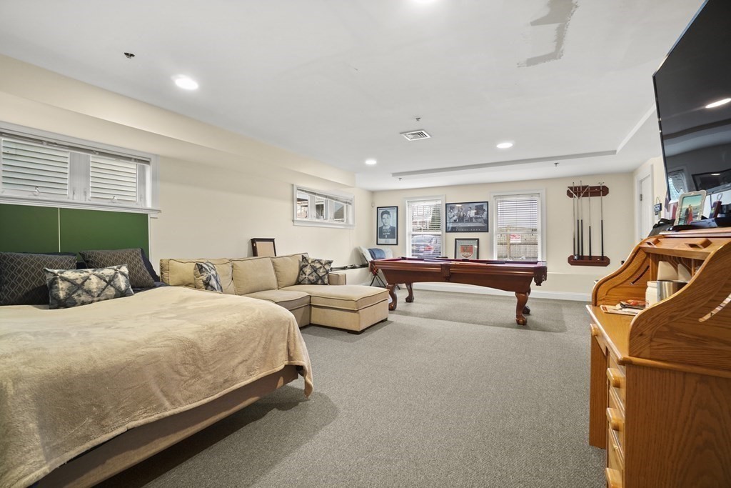 8 Howell Street, Unit 1 Boston, MA 02125 - Photo 8 of 14 a bedroom with bed and window