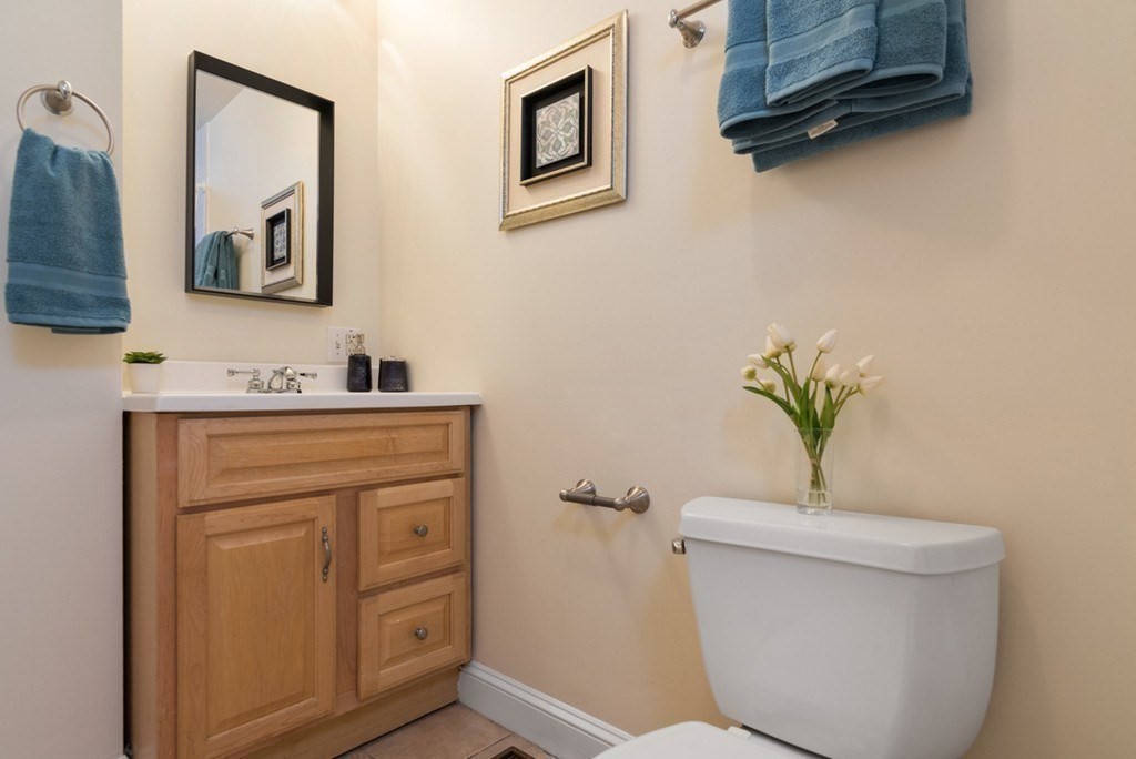 8 Howell Street, Unit 1 Boston, MA 02125 - Photo 10 of 14 a bathroom with a toilet a sink and mirror