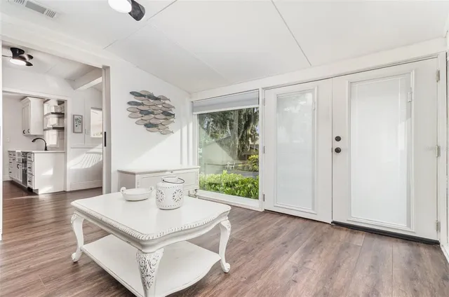 a view of kitchen with furniture and wooden floor