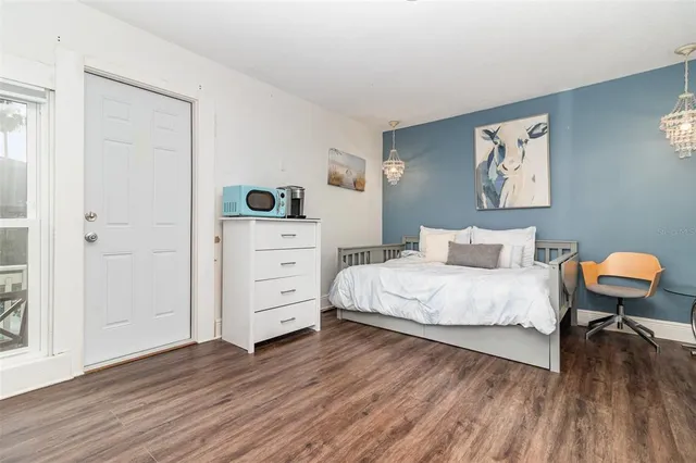 a bedroom with a bed and a dresser