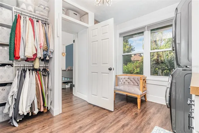 a view of front door with furniture and a window