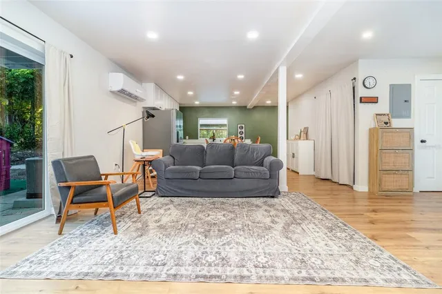 a living room with furniture and a rug