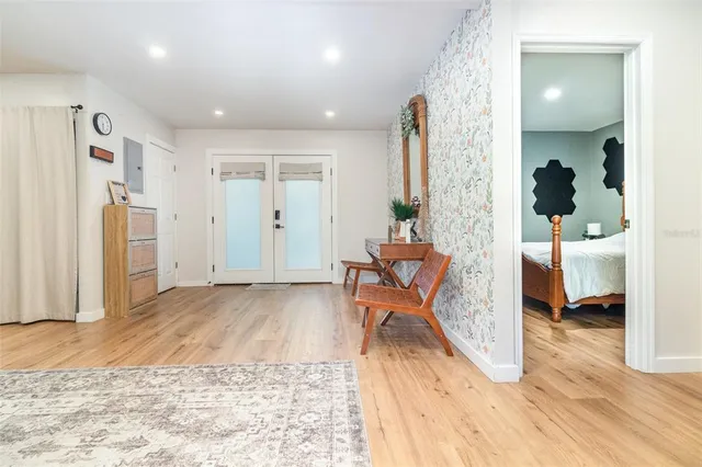 a living room with furniture and a large window