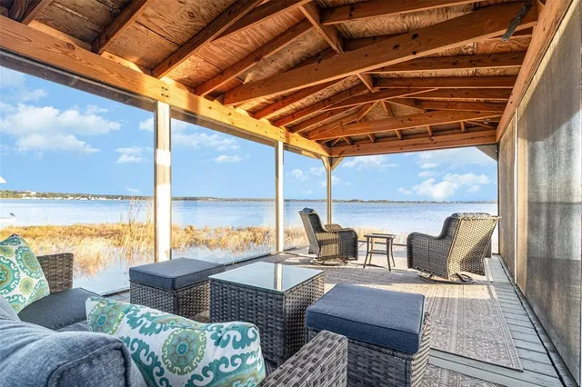 a outdoor living space with patio furniture and a glass door