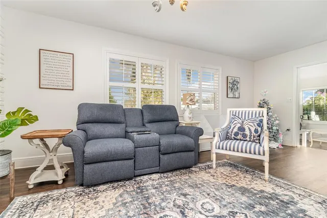 a living room with a couch and a window