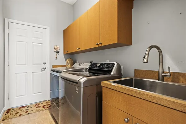 a view of a kitchen with sink and cabinets