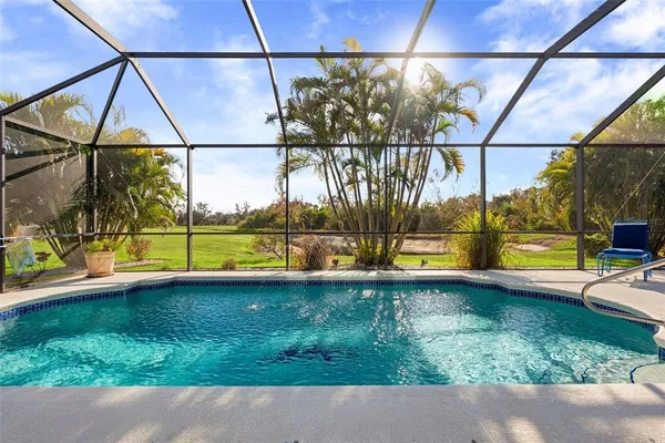 a view of swimming pool with a yard