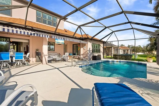 a view of a swimming pool with a patio