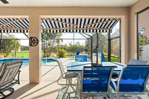 a view of a dining room with furniture window and outside view