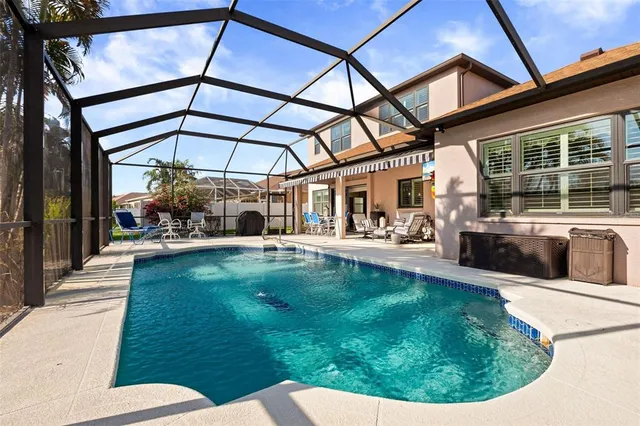 a view of a swimming pool with a patio