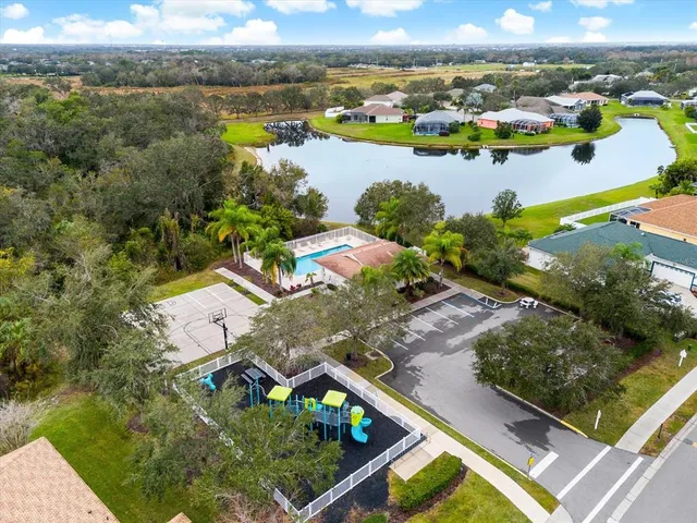 an aerial view of a house with a lake view
